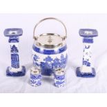 A pair of Royal Doulton Willow pattern candlesticks, a pair of similar condiment holders and a