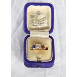 An 18ct gold, diamond and sapphire dress ring, the central diamond .75 carat approx (one sapphire