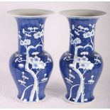 A pair of Chinese blue and white baluster vases decorated cherry blossom, 17" high