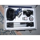 A Praktica MTL 50 35mm SLR camera together with two lenses, flash and aluminium carry case