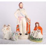 A 19th Century Staffordshire "Burns and Mary" watch group, 12" high, an arbour group, 13" high, a "