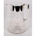 An Asprey's lemonade jug with silver plated top and handle, integral ice container, 10" high