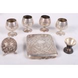 A silver cigarette case, four Gorham miniature silver goblets, an Indian silver pepperette and one