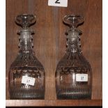 A pair of Georgian decanters with three-ring necks, base cut flutes
