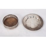 A pierced silver bottle coaster with turned wooden base together with a silver pin dish