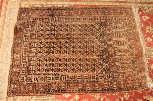 A Caucasian prayer rug decorated three panels of geometric motifs and three border stripes, 48" x