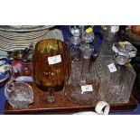 Three decanters and stoppers, a claret jug with plated mount, a Murano glass shallow bowl and