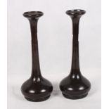 A pair of Japanese bronze vases with elongated slender necks, 9 1/2" high