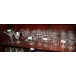 A part suite of Edwardian engraved drinking glasses and other glasses