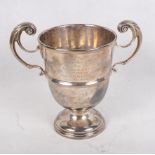 A silver two-handled pedestal trophy cup with engraved presentation inscription, 13.7oz troy approx
