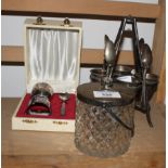 A cut glass preserve jar with plated mounts, a plated egg cruet and a christening set in case