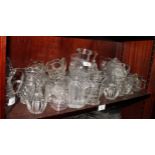 A collection of mainly moulded glass jugs