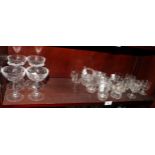 A collection of assorted custard cups and six champagne glasses with panelled shallow bowls