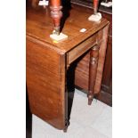 A 19th Century mahogany Sutherland dining table, on turned supports, 42" wide