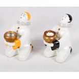 A French porcelain inkwell and pen holder in the form of a kneeling Pierrot and a similar