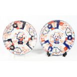 A pair of late 19th Century Imari lobed dishes, 12" dia (one chipped rim)