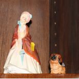 A Royal Doulton china figure, "Paisley Shawl" HN1988, and a Doulton figure of a Pekinese dog