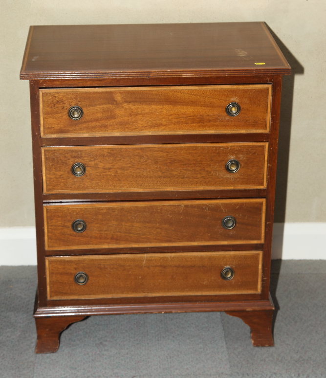 A Georgian design mahogany and satinwood banded chest of four drawers, on bracket supports, 25"