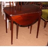 A late 19th Century mahogany oval Pembroke table, on square taper supports, 24" wide