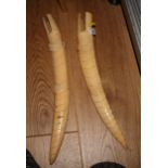 A pair of early 20th Century African carved ivory tusks formed as crocodiles, 16" long