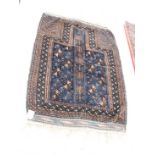 A Turkish prayer rug decorated in shades of blue and brown, 52" x 33"