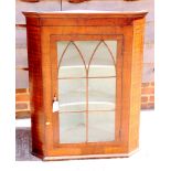 A Georgian mahogany and box line inlaid corner hanging cabinet enclosed Gothic lattice glazed