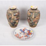 A pair of Satsuma relief decorated vases with figured panels, 10 1/2" high, and three Imari