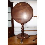 A Victorian mahogany circular tilt top occasional table, on circular base, 21" dia