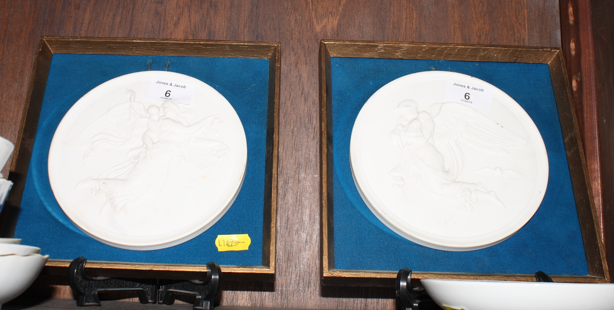 A pair of Royal Copenhagen porcelain plaques after Thorvaldsen, "Night" and "Day", 6" dia