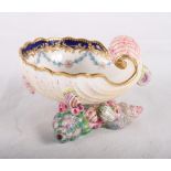 A Royal Worcester china sweetmeat dish moulded as a shell on shell decorated base, centre painted