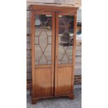 A Chippendale design mahogany display cabinet enclosed two astragal beaded and plain panelled doors,