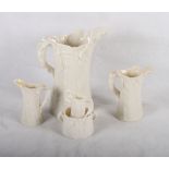 A set of four Royal Worcester china leaf moulded jugs, in sizes, largest 8" high, and a similar