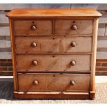 A late 19th Century mahogany chest of two short and three long drawers with knob handles, 42" wide