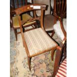 A set of three Regency mahogany bar back dining chairs