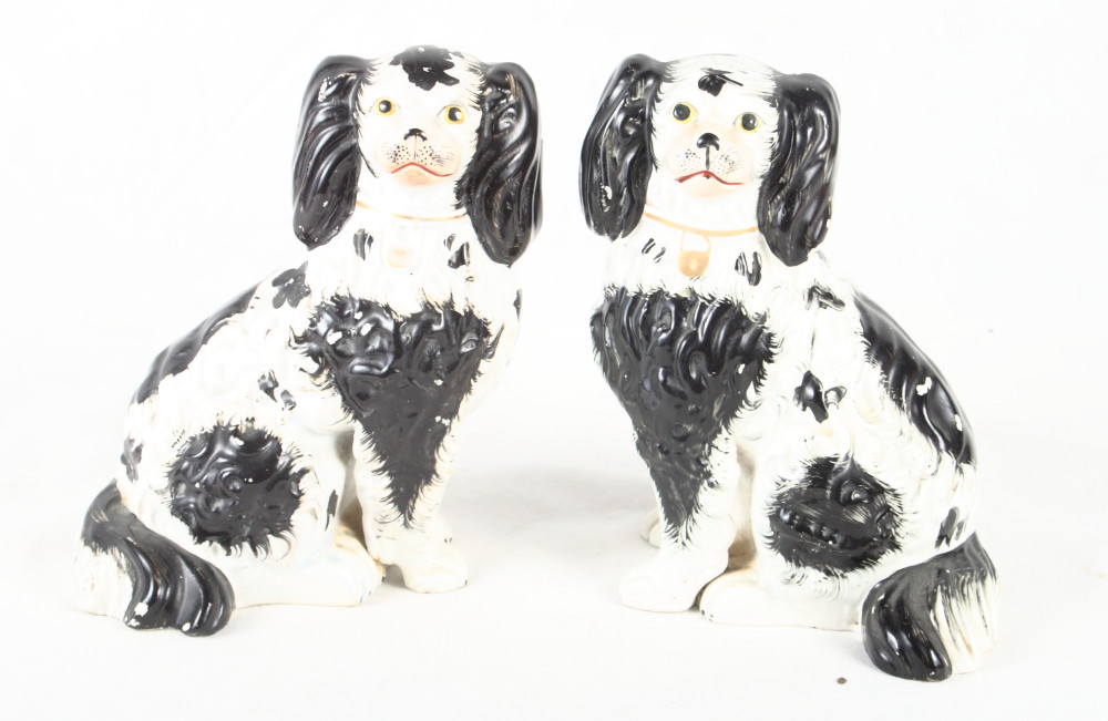 A pair of 19th Century Staffordshire spaniels, 8" high