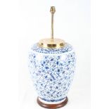 A Delft ware jar now converted as a lamp base with all-over scroll and animal design, 23" high (