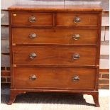 An early 19th Century mahogany chest of two short and three long graduated drawers with brass