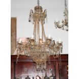 An eight-light circular gilt metal framed chandelier hung glass drops, 17" dia