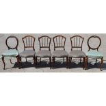 A set of four late Victorian walnut vertical rail back side chairs, on turned supports, and a pair