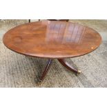 A mahogany and banded oval coffee table, on quadruple splay supports, 48" wide