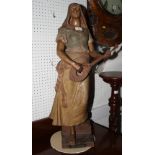 A Goldschieder figure of a lady playing a mandolin, "Mignon", 31" high (mandolin restored)
