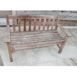 A slatted teak garden bench, 51" wide