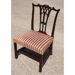 An early 19th Century Chippendale design mahogany standard chair with pierced central splat, stuffed