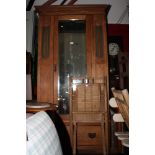 An early 20th Century oak single wardrobe with centre mirror door, fitted drawer to base, 41" wide