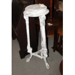 A 19th Century white painted circular plant stand, on three supports