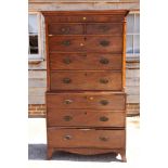 A George III mahogany tallboy, the upper section with canted corners fitted two small and three long