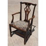 An early 19th Century Chippendale design carver chair with pierced splat, drop-in floral gros