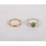 An 18ct gold, diamond and emerald dress ring and an 18ct gold wedding band