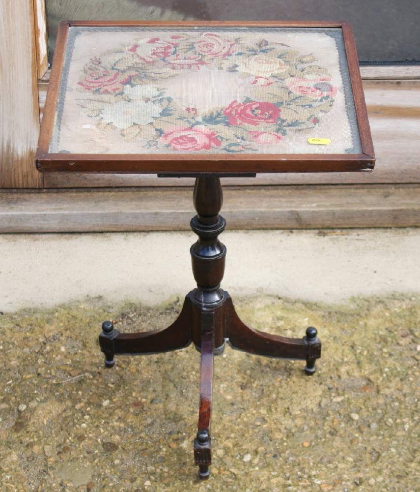 An Edwardian occasional table with needlepoint top, on tripod splay supports, 14" square