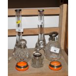 A pair of glass specimen flower vases, two glass scent bottles, a pair of orange glass salts and a